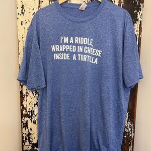 NWOT “I’m A Riddle Wrapped In Cheese Inside A Tortilla”. Funny unisex T-shirt.